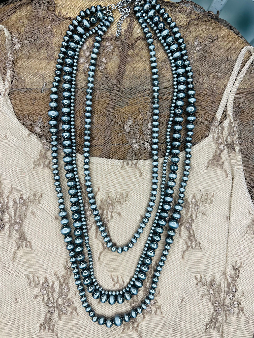 Four strand pearl necklace