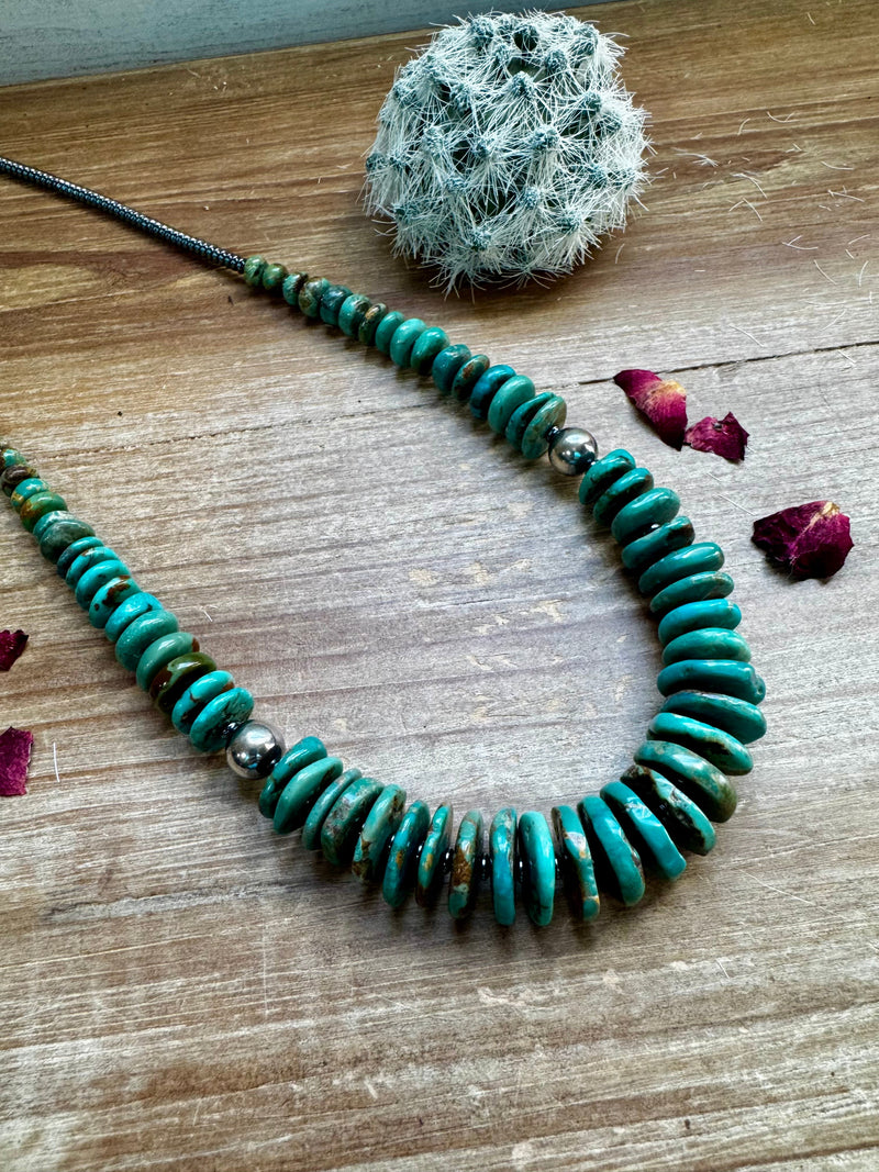 22 inch greener graduated turquoise necklace with Sterling silver pearls